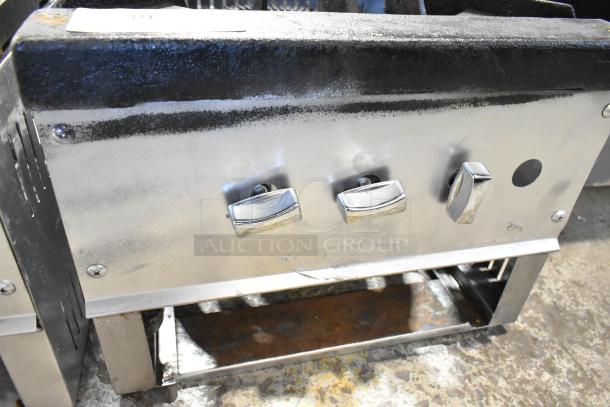 Stainless steel commercial countertop single burner gas range with control knobs; used condition, minor surface wear.