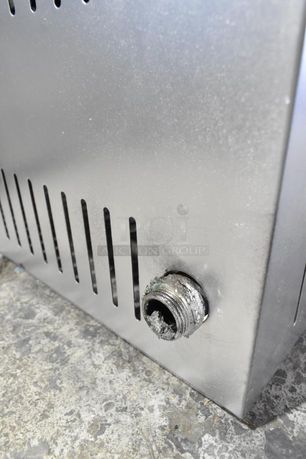 Stainless steel single burner stock pot range, gas-powered, commercial countertop model, visible gas inlet, good condition.