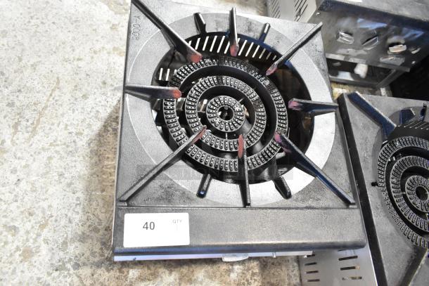 Stainless steel commercial countertop gas-powered single burner stock pot range, model tag visible, in good condition.