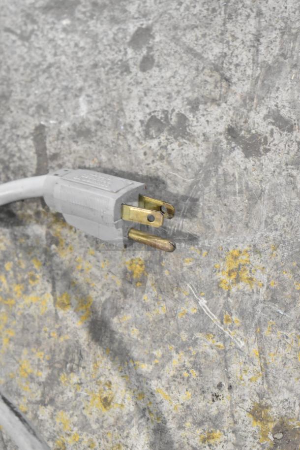 Close-up view of a power plug on a 115-volt, 1-phase Electro Freeze HDM75A drink mixer.