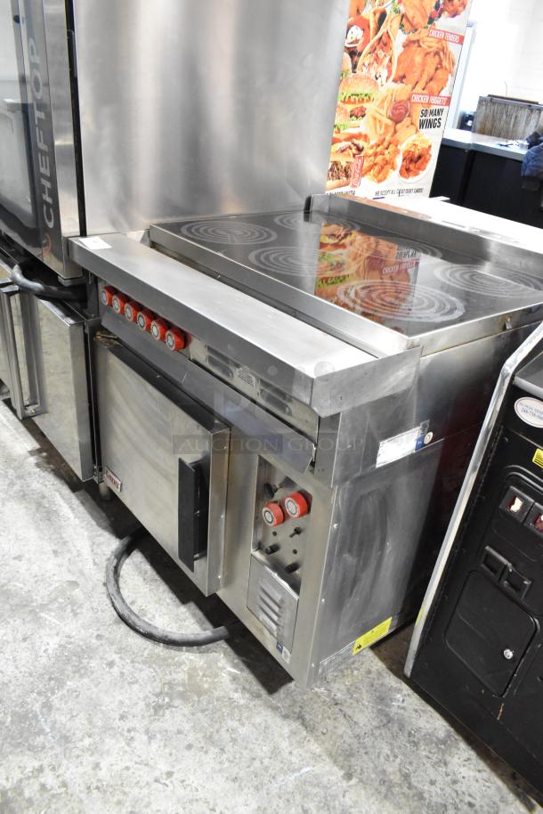 Lang RTI36E commercial electric range, stainless steel, 6 burners, with oven, 208-240V, 3 phase, good condition.