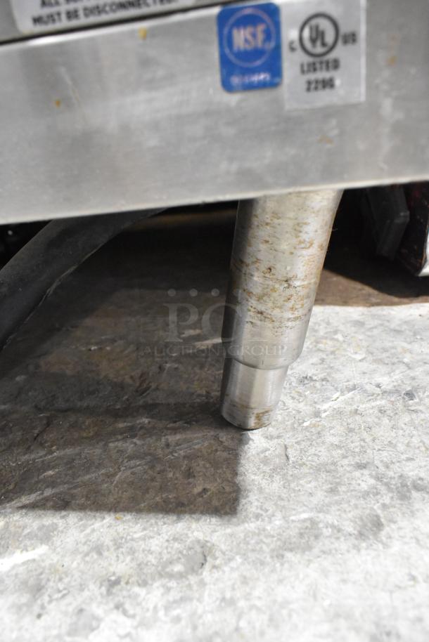 Lang RTI36E stainless steel electric range leg. Features NSF, UL markings. Suitable for commercial kitchens.