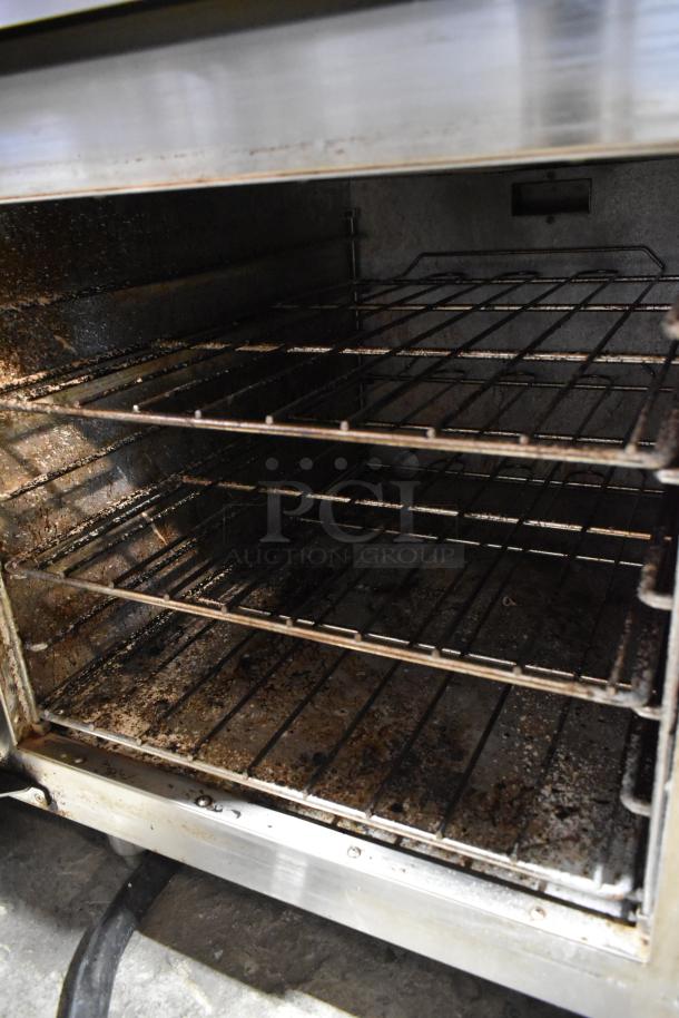 Lang RTI36E stainless steel commercial electric range oven interior with used racks, 208-240V, 3 phase, 6 burners.