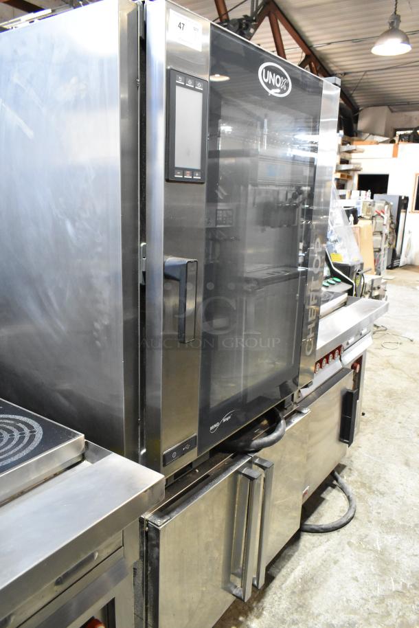 Cadco Unox XAVC-10FS-GPR stainless steel commercial combi oven on equipment pan rack stand, excellent condition.