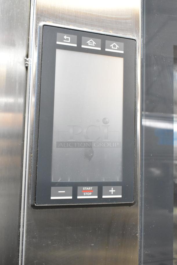 Cadco Unox XAVC-10FS-GPR combi oven panel with touchscreen controls in stainless steel.