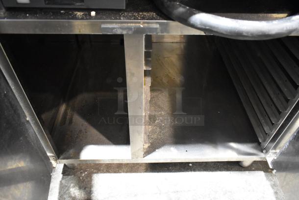 Cadco Unox XAVC-10FS-GPR commercial combi oven with stainless steel equipment pan rack stand. Well-used condition.