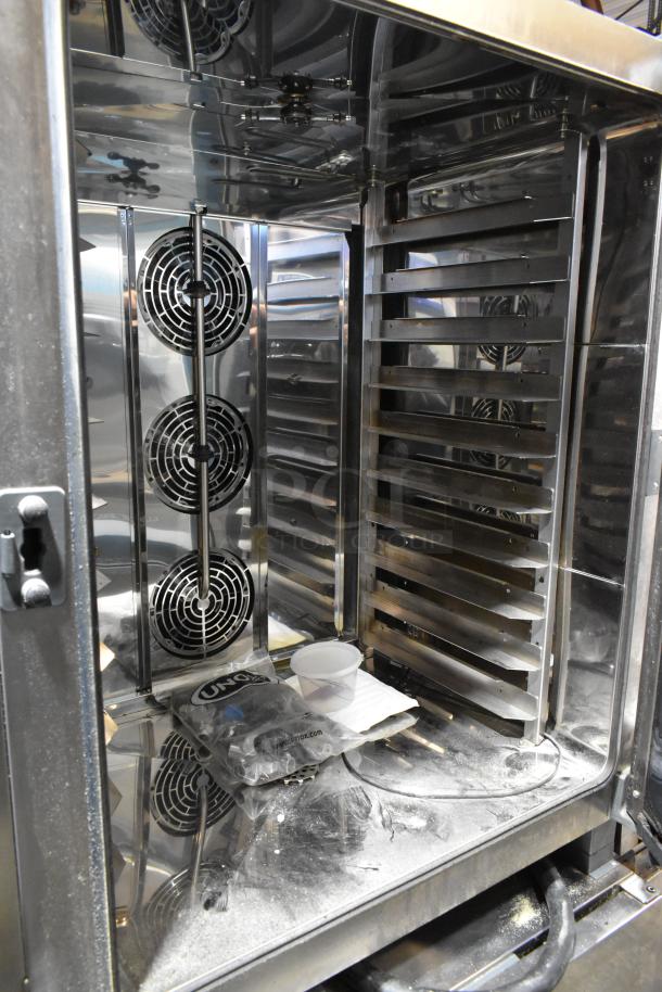 Cadco Unox XAVC-10FS-GPR stainless steel commercial combi oven, half size, on pan rack stand, interior view.