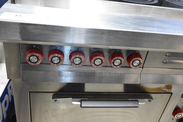 Lang RTI36E stainless steel 6 burner electric range with oven, red control knobs, 208-240V, 3 phase, commercial use.