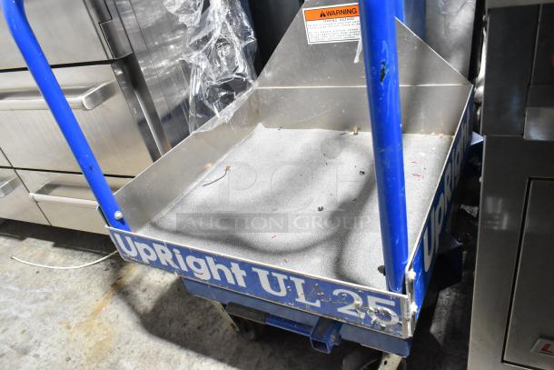Upright UL25 068001-000 metal vertical lift mast, blue with visible wear, warning label, and "UpRight UL25" branding.