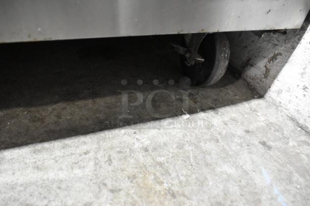 Turbo Air TUR-48SD stainless steel undercounter cooler, equipped with two doors and commercial casters. 115V, 1 phase.