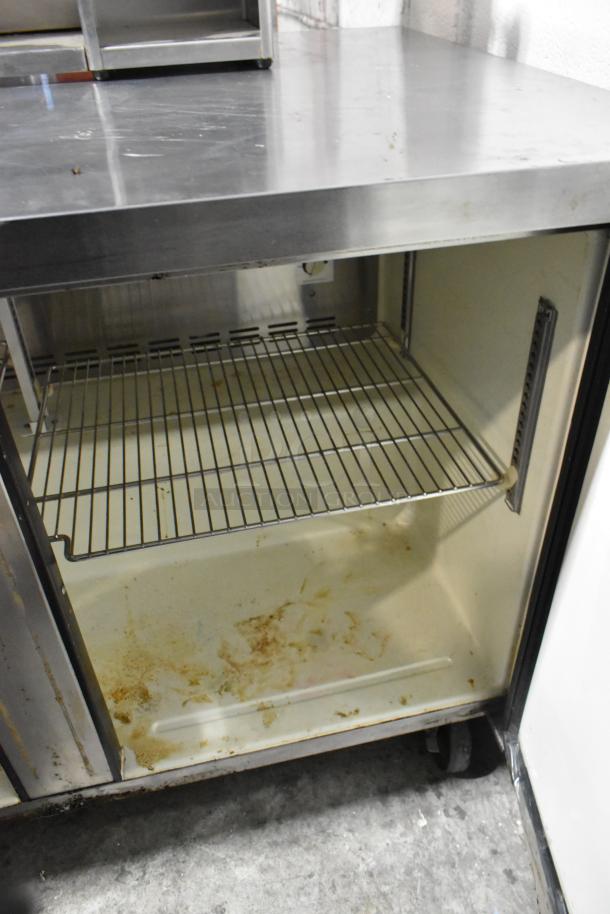 Turbo Air TUR-48SD Stainless Steel 2-Door Undercounter Cooler with commercial casters. Moderate wear, 115V, 1-phase.