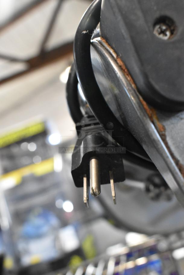 Hamilton Beach HMD400 commercial blender plug and cord close-up; used condition, rust visible on metal housing.