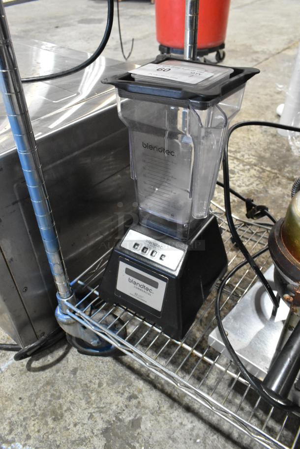 Blendtec ES3 countertop blender, black base, clear jar, 120 volts, 1 phase. Good condition, visible control panel and markings.
