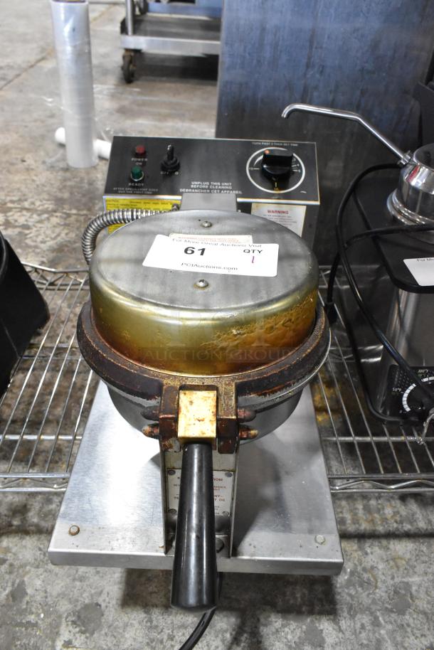 5020 Stainless Steel Commercial Waffle Cone Maker. Features robust handle, control panel with dial. Shows signs of wear. 120V.
