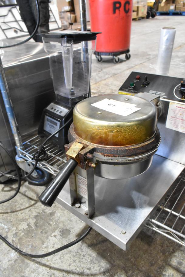 5020 Stainless Steel Commercial Waffle Cone Maker, 120 Volts, 1 Phase. Used condition with visible wear and label. Model 5020.
