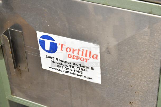 Lenin MQ077 automatic tortilla machine, metal, on commercial casters. Features 110V, 1 phase. Label indicates Tortilla Depot info.