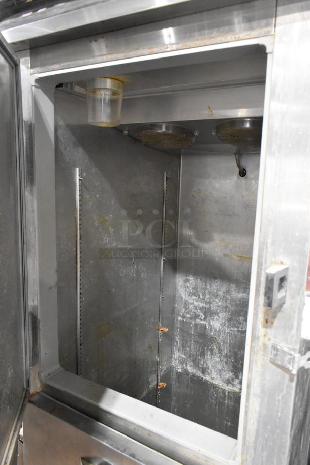 Continental 1R-HD stainless steel reach-in cooler with two half-size doors, commercial casters, 115 volts, 1 phase.