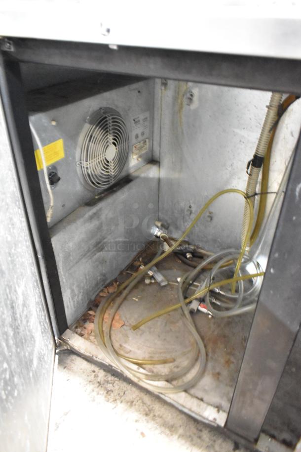 Micro Matic MDD-58 kegerator interior showing cooling unit, fan, and hoses. Used commercial model, 115V, 1 phase.