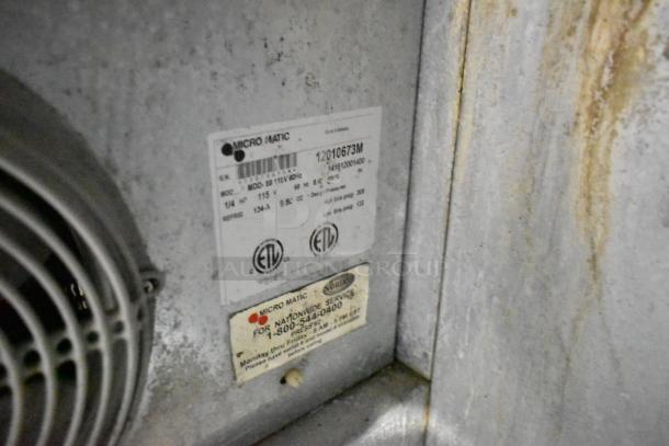 Micro Matic MDD-58 kegerator label detailing 115 volts, 1 phase. Metal surface shows wear. ETL certification visible.