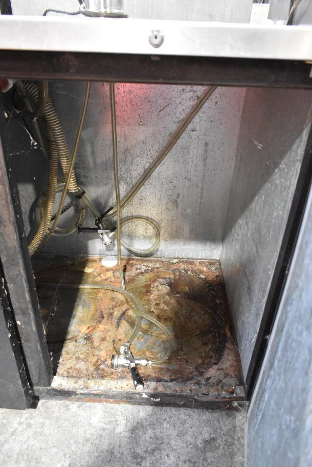 Micro Matic MDD-58 metal commercial kegerator interior. Features tubing, coupler, worn surface. 115 volts, 1 phase.