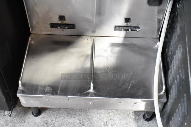 2016 Bunn DUAL SH stainless steel coffee machine base. Features dual brewing, hot water dispenser; 120/240V.