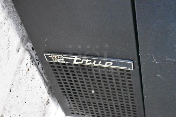 True TDB-24-48 metal kegerator, features 3 tap beer tower, 115 volts, 1 phase, True brand label visible.