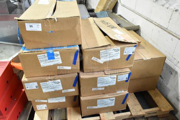 Boxes of 9 Current Evolve LED Series Area Lights, unopened, with visible labels indicating model numbers and specs.