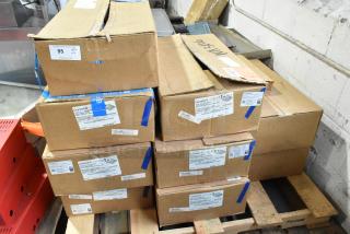 Boxes of 9 Current Evolve LED Series Area Lights, unopened, with visible labels indicating model numbers and specs.