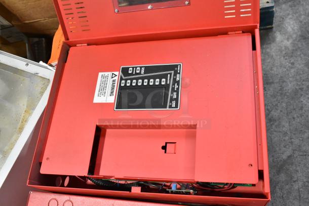 Red PowerPath Wheelock SP40S cabinet with control panel and warning label, part of a lot of 13 various items.