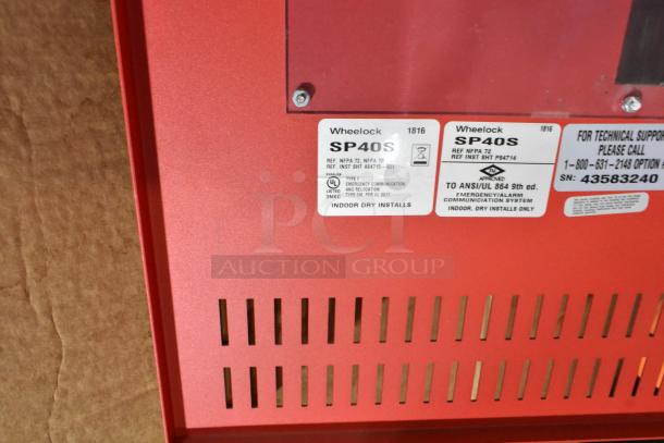 Red Wheelock SP40S cabinet with identification labels for emergency communication systems; indoor, dry installs only.