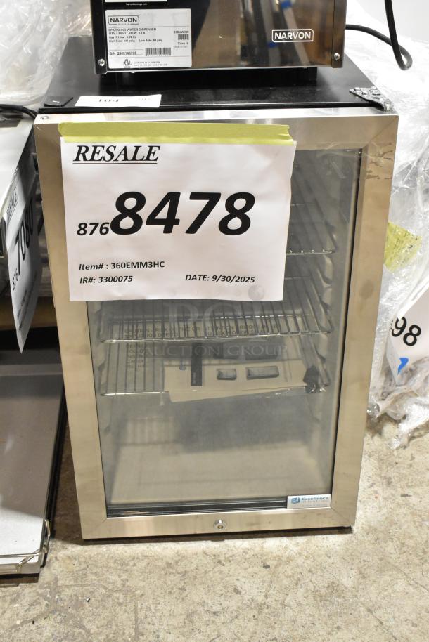 Brand new Excellence EMM-3HC black countertop display refrigerator with swing door, 115 volts, 1 phase; some scratches.
