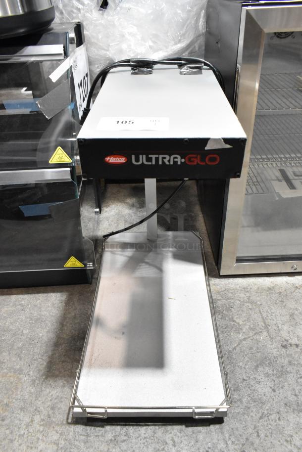 Brand new Hatco Glo-Ray 413GRFFBL portable food warmer with heated base and overhead light. Features 120 volts, 1 phase.
