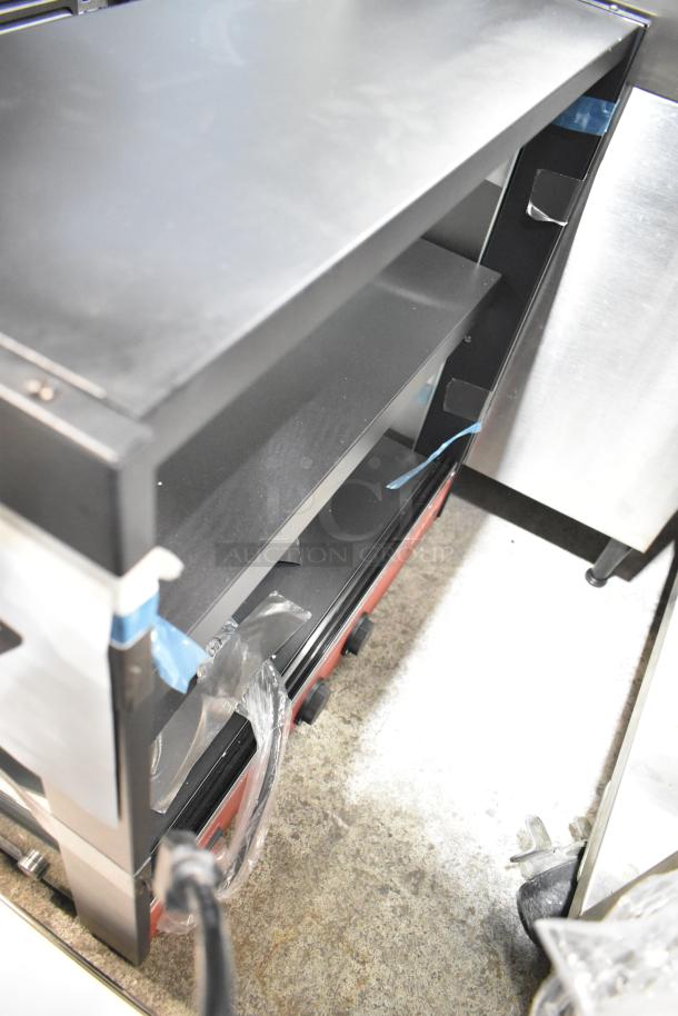 Avantco OAM2A 26" black countertop merchandiser, brand new, with LED lighting, 2 shelves, visible minor scratches.