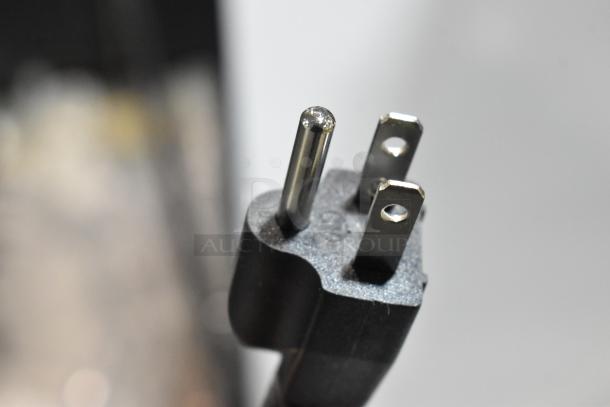 Close-up of a plug for a Vitamix 965580 Mix'n Mixer, highlighting a standard three-prong design.