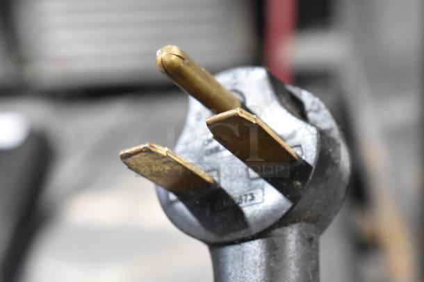 Close-up of a 2016 Turbochef Encore 2 oven power plug, showing a three-prong configuration for 208/240 volt connection.