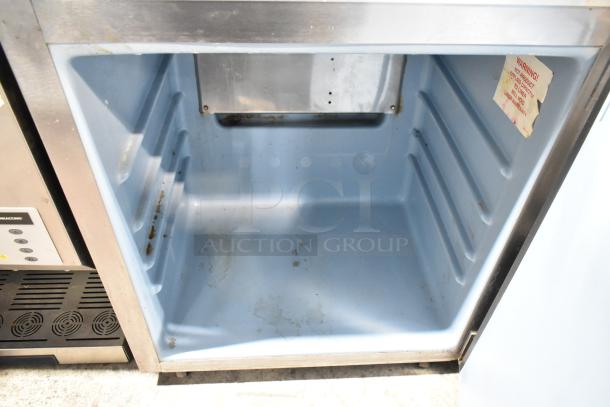 Delfield 406CA-DD1 stainless steel undercounter cooler, single door, 115V, showing interior condition and label details.