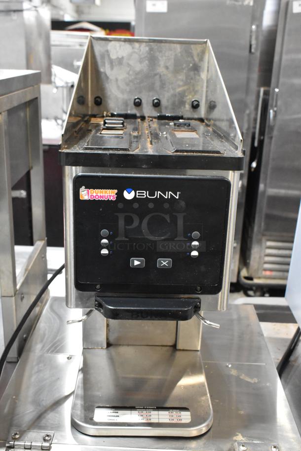 2018 Bunn MHG stainless steel commercial coffee bean grinder, countertop model, 120 volts. Features include control buttons and branded front panel with Dunkin' Donuts and Bunn logos.