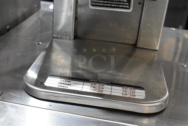 2018 Bunn MHG stainless steel coffee grinder base, 120V, 1 phase. Grind weight guide visible. Clean, commercial use.