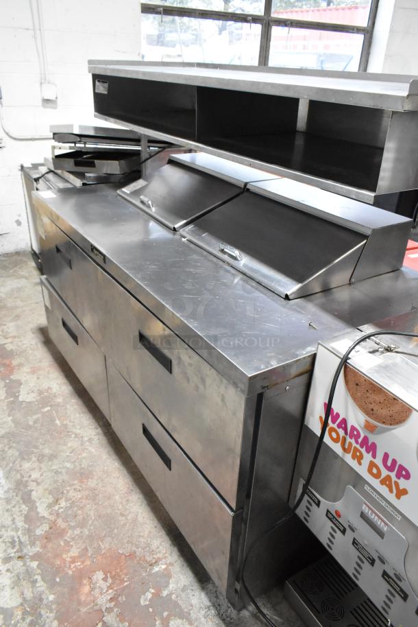 Delfield stainless steel sandwich salad prep table, bain marie mega top, 4 drawers, over shelf, 115V, used condition.