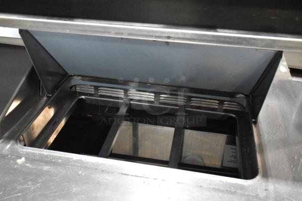 Delfield stainless steel commercial prep table with 4 drawers, over shelf. Bain Marie mega top, 115V, 1 phase.