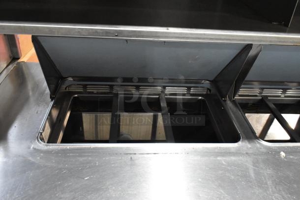 Delfield stainless steel prep table with bain marie top, 4 drawers, shelf. Suitable for sandwich/salad, 115V, 1 phase.