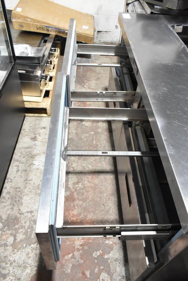 Delfield stainless steel commercial sandwich prep table, features 4 drawers, over shelf, Bain Marie mega top, 115V, 1 phase.