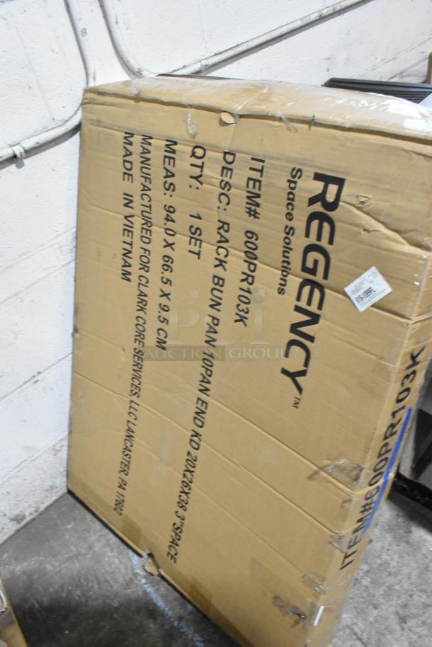 Cardboard box of Regency 600PR103K 10 Pan Rack, labeled "scratch and dent," unassembled, dimensions 94x66.5x9.5 cm.