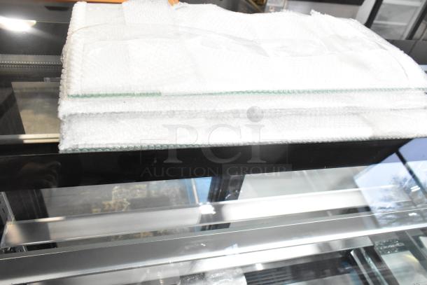 BRAND NEW Avantco 193BCT48B 49" black 3-shelf curved glass bakery display case, LED lighting, 110-120V, 1 phase, in packaging.