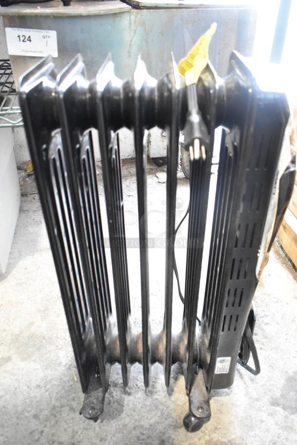 Honeywell KAZ HZ-709-WMT electric heater, 120V, 1-phase, black finish, radiator-style, with visible power cord and wheels.