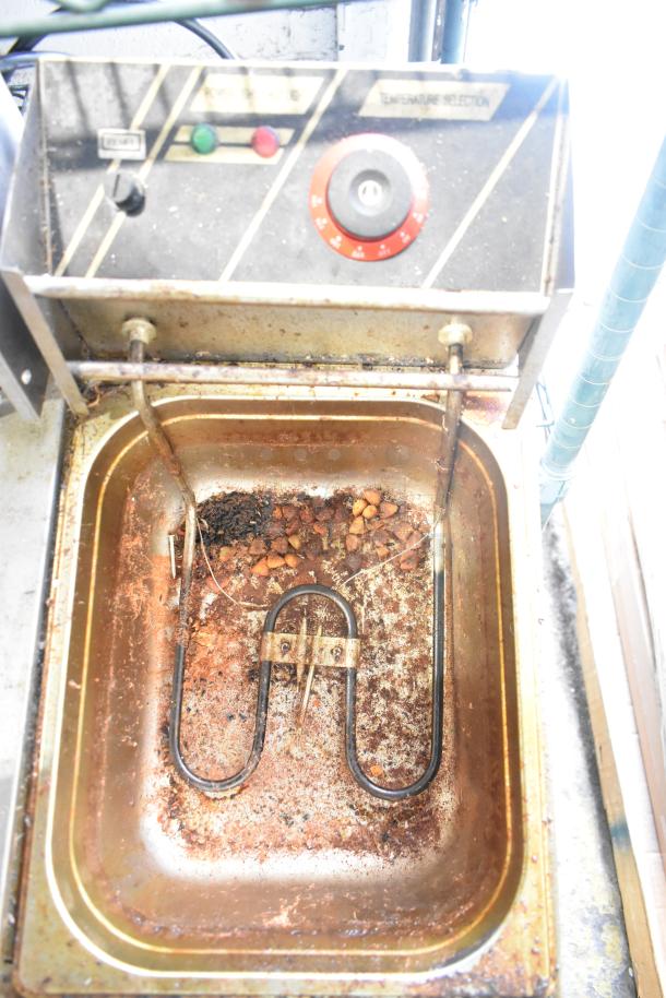 ET-ZL2 stainless steel 2 bay fryer, electric, countertop, 110 volts, 1 phase, with signs of use and residue inside.