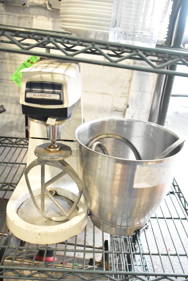 Blakeslee K7 metal dough mixer with mixing bowl and pastry paddle. 120 Volts, 1 Phase. Used condition, visible wear.