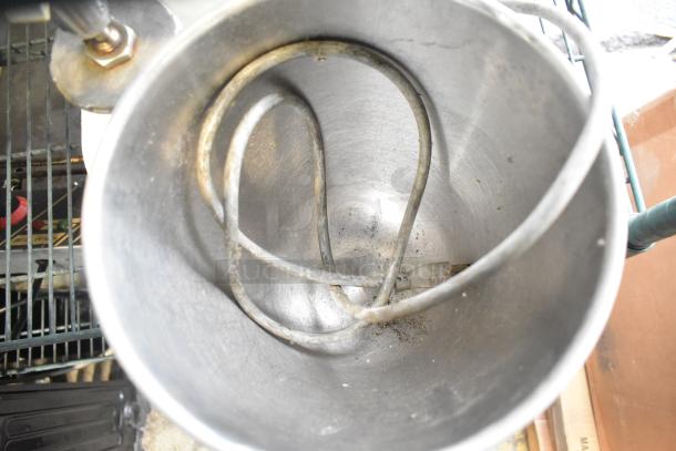 Blakeslee K7 metal countertop dough mixer with mixing bowl and pastry paddle attachment, shows signs of use. 120V, 1 phase.