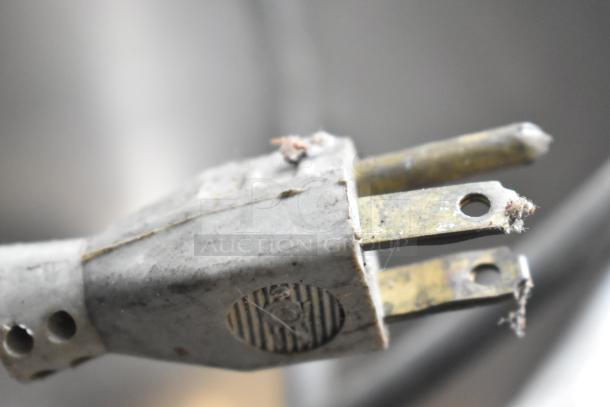 Blakeslee K7 metal dough mixer plug, showing wear on prongs. 120 volts, 1 phase. Mixer not visible in image.