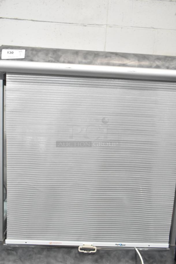 Metal commercial vertical reach-in grab n go merchandiser, 115 volts, 1 phase, with roll-down door and visible temperature display.